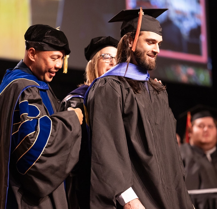 Graduate at Commencement