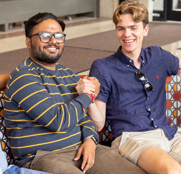 Two students shaking hands