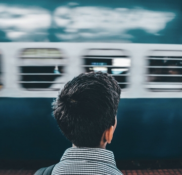 Man watching a speeding train