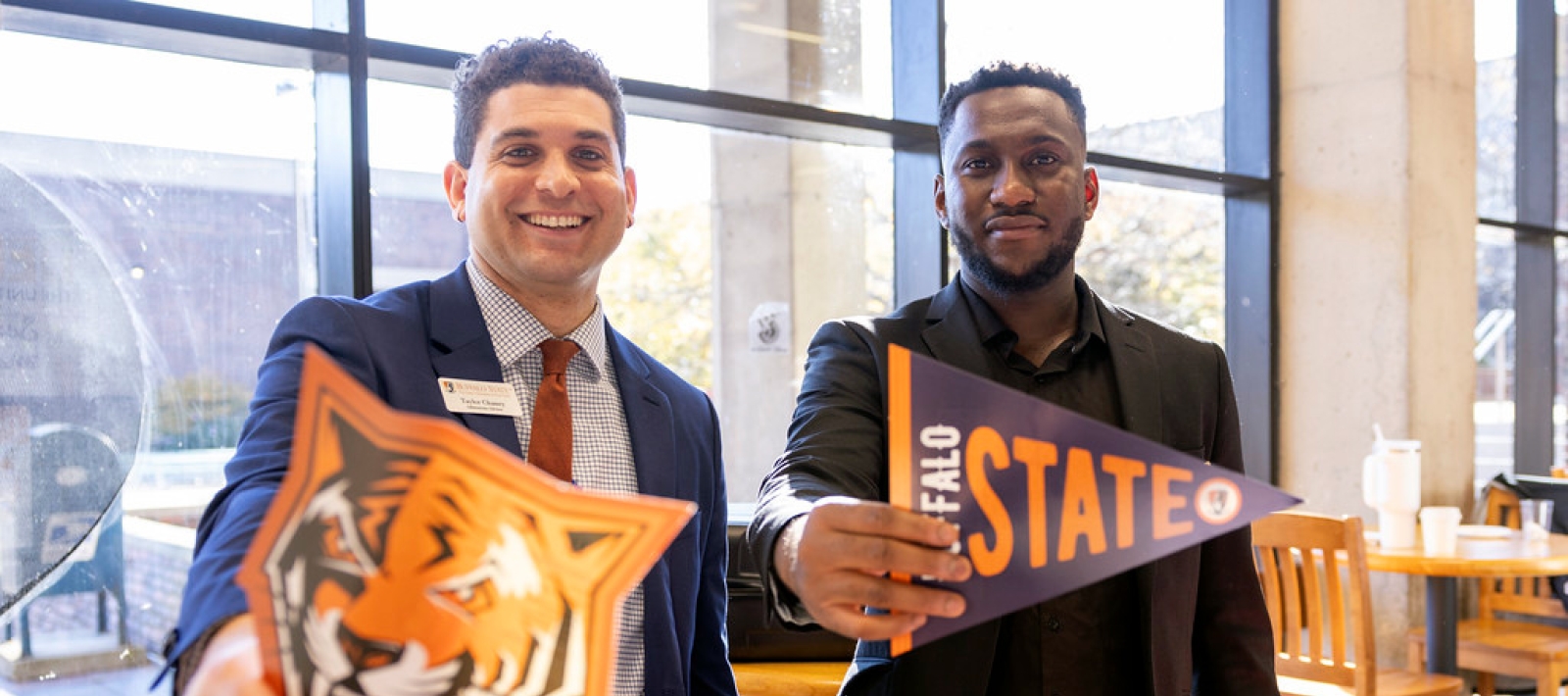 Two men holding banners