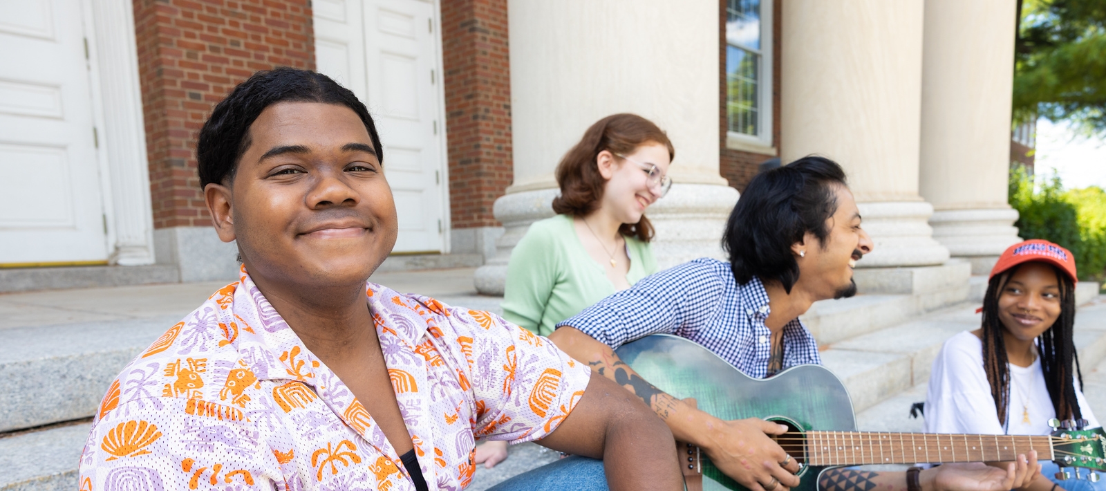 Students sit outside Rockwell Hall